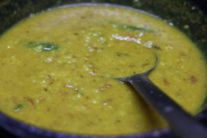 simmering moong dal in onion tomato masala