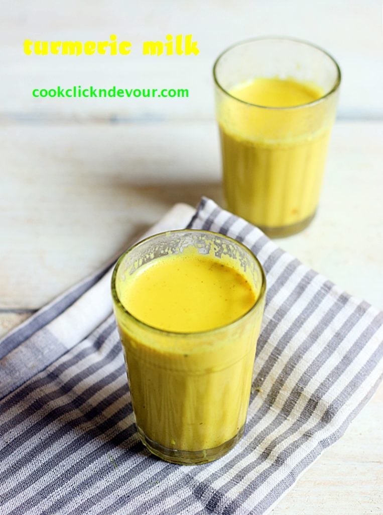 healing and immunity boosting turmeric milk served warm in two glasses