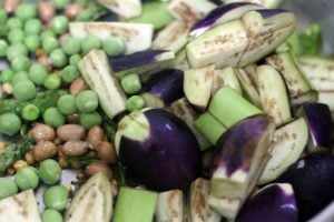 chopped brinjals and green peas added