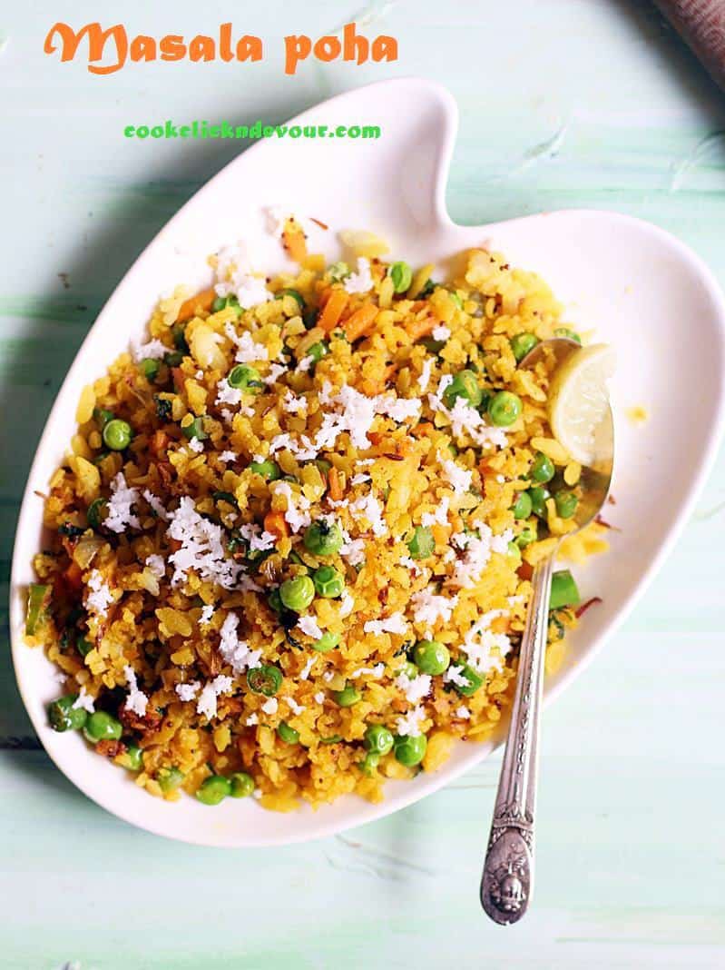 masala poha recipe- a white plate containing poha or rice flake with Indian spices 
