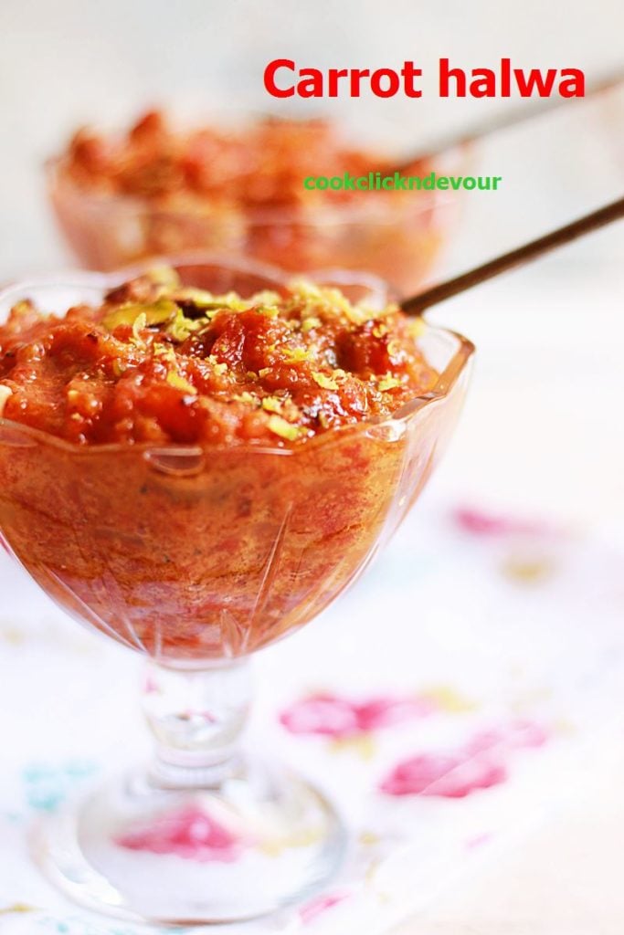 Carrot halwa recipe- a glass bowl containing carrot halwa garnished with fried nuts.