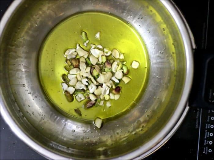 Frying cashews in ghee for gajar ka halwa recipe