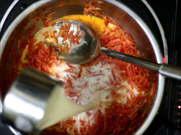 milk added to sauteed carrots for carrot halwa