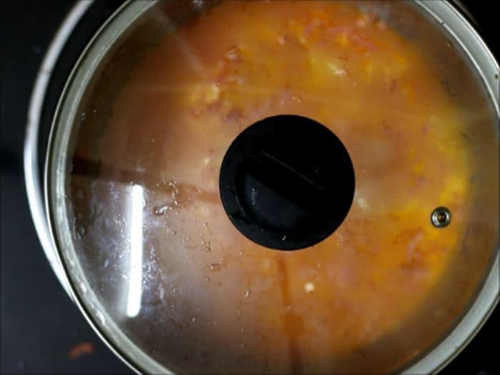 cooking carrots in milk for making carrot halwa