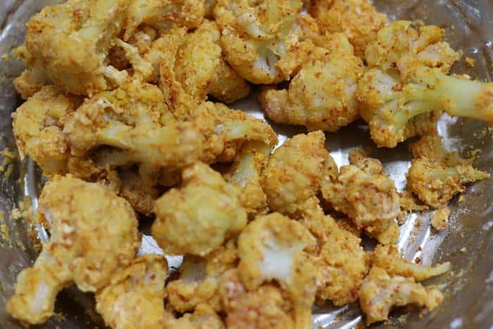 Flours tossed gobi florets for cauliflower fry recipe.