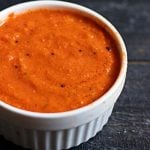 tomato ginger chutney recipe- A small white bowl with tangy and flavorful tomato chutney flavored with ginger.