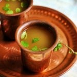 healthy and refreshing panakam (south Indian summer drink) with jaggery, water, lemon juice served in a copper tumbler