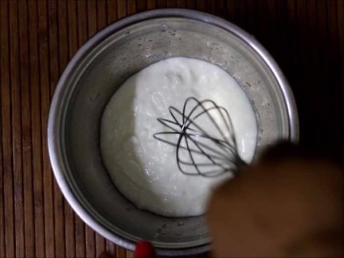 whisking yogurt for aloo raita