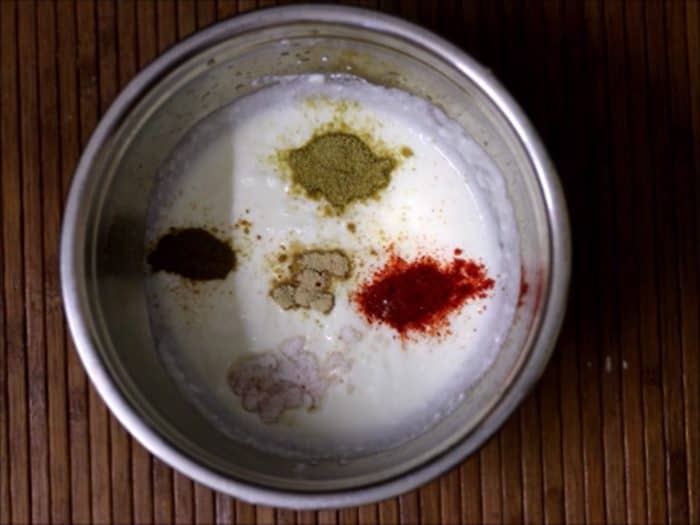 adding spice powders for aloo raita