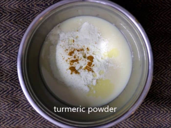 Butterscotch Ice Cream Recipe 1 Condensed milk, turmeric milk and milk powder combined in a mixing bowl.