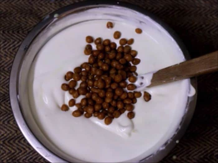 adding butterscotch chips to whipped ice cream mixture