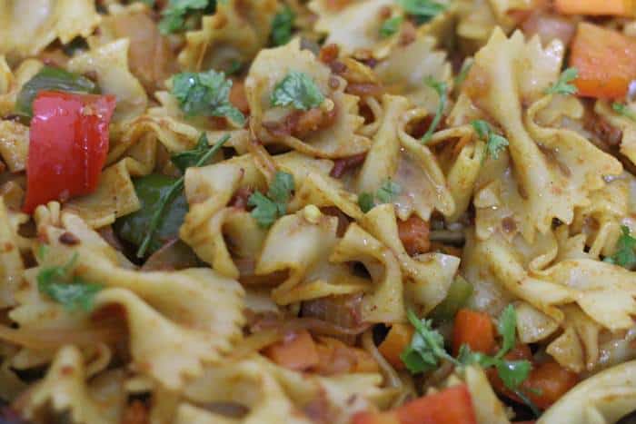 cilantro leaves and lemon juice added to Indian pasta