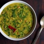 palak dal recipe- Indian style delicious lentils cooked with spinach leaves served with rice for lunch.