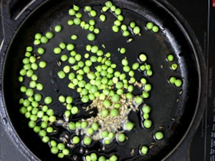 sauteing fresh green peas-making gobi matar recipe