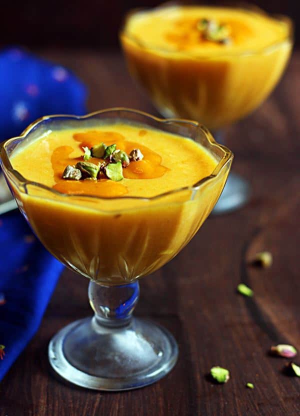 Mango custard recipe-homemade eggless mango custard served with nuts for dessert.