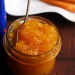 Homemade mango jam in a short jar,