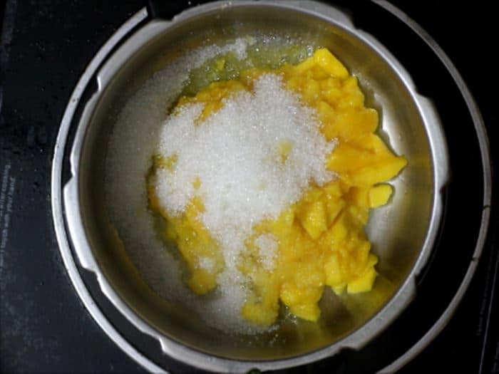 Sugar added to mangoes for making jam