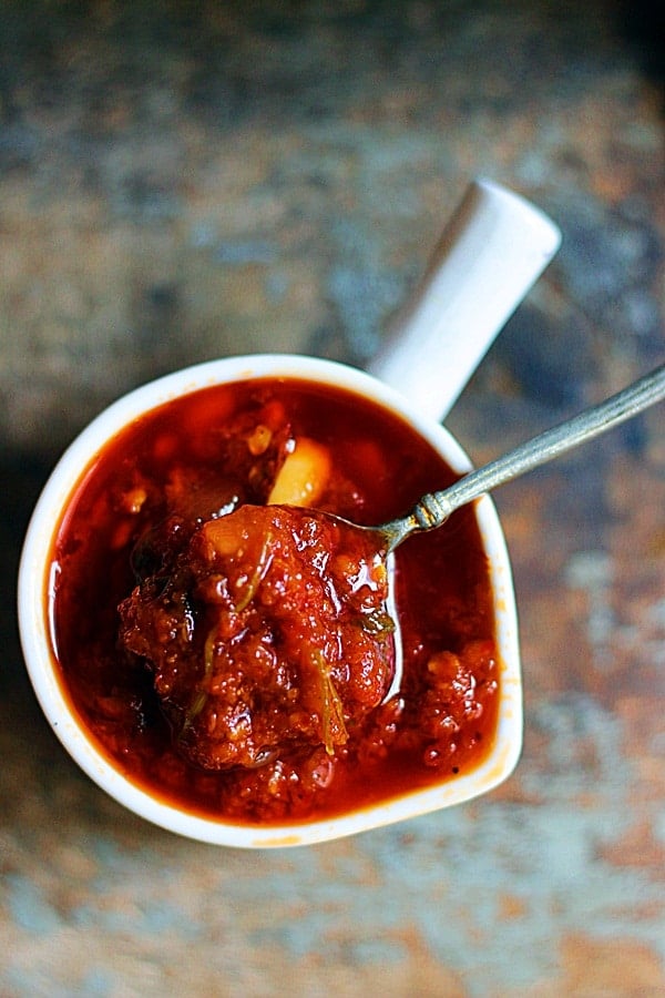 Overhead shot of schezwan sauce with minced garlic