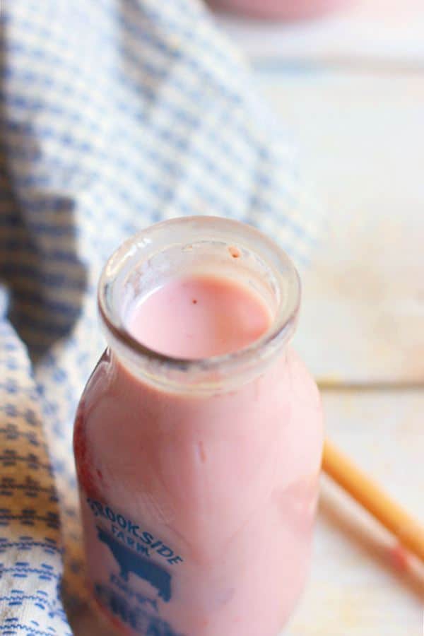 Homemade Strawberry Milk served in a bottle