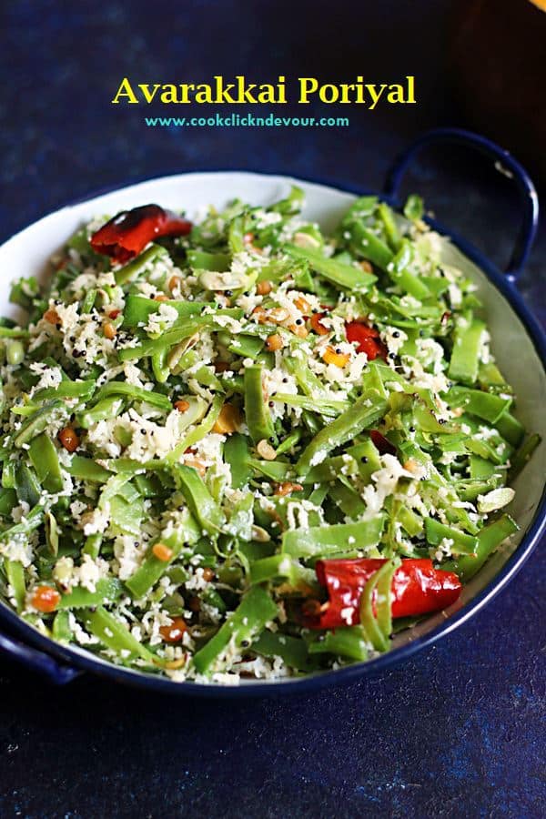 Avarakkkai Poriyal with loads of freshly grated coconut garnish served in a blue rimmed pan for lunch