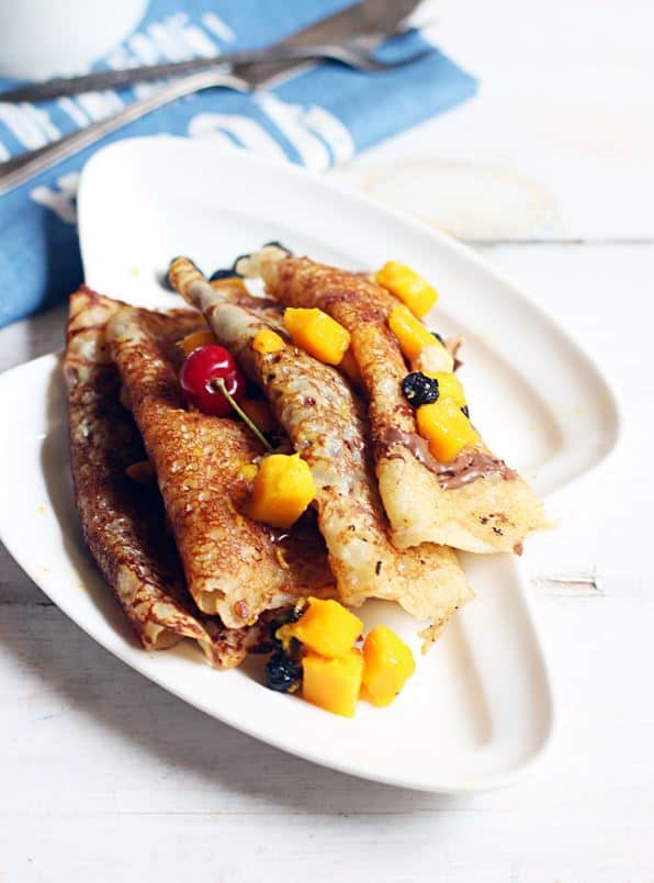 eggless crepes recipe-a plate containing sweet dessert egg free crepes