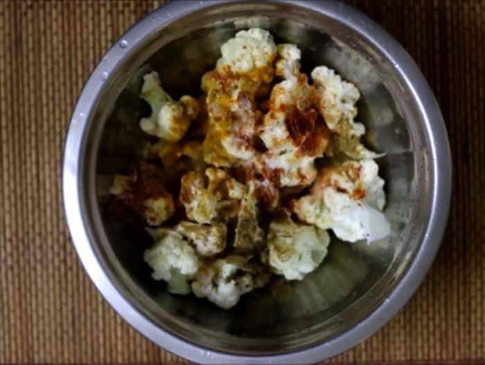 seasonings added to par boiled cauliflower