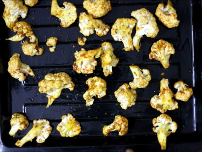 seasoned cauliflower ready to be roasted