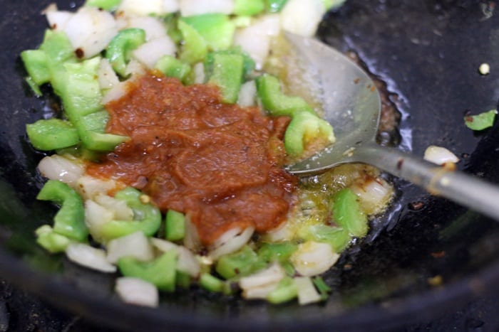 sauces added to sauteed onions and peppersfor recipe of gobi manchurian