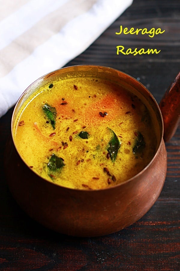 Spicy and flavorful jeera rasam or thin cumin soup served in a copper sauce pan