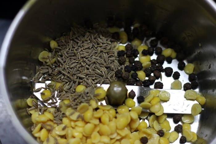 cumn seeds, peppercorns and toor dal added in a mixer jar