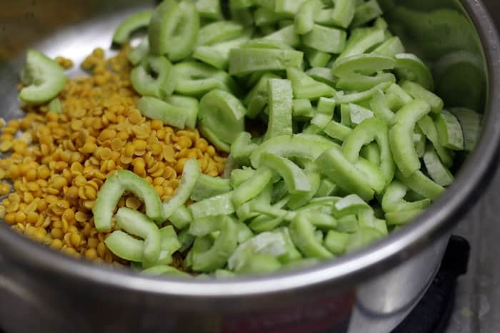 chopped snake gourd and toor dal in a pressure cooker