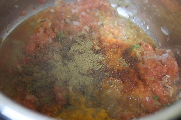 spice powders added to tomato puree