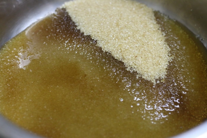 mixing sugar and water for salted caramel sauce recipe