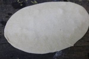water applied on one side of the roti