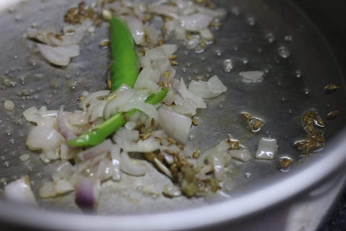 sauteing onions for making aloo matar recipe