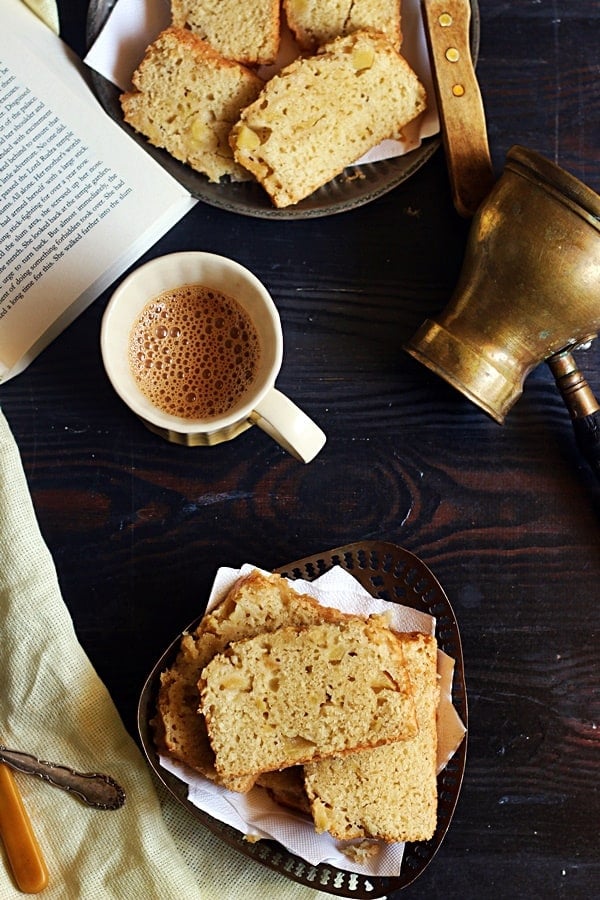 An overhead shot of egg free cinnamon apple cake served with tea