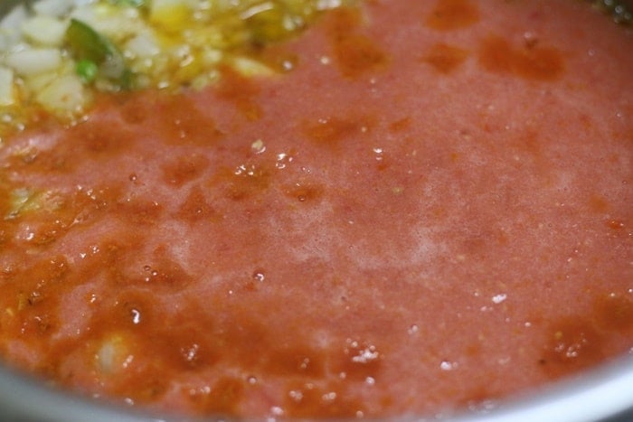 adding tomato puree for making veg kadai recipe