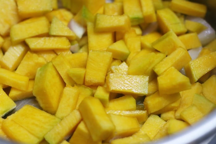 sauteing pumpkin in olive oil for pumpkin soup recipe 