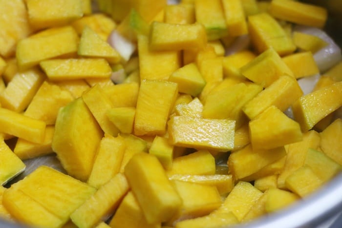 sauteing pumpkin in olive oil for pumpkin soup recipe 