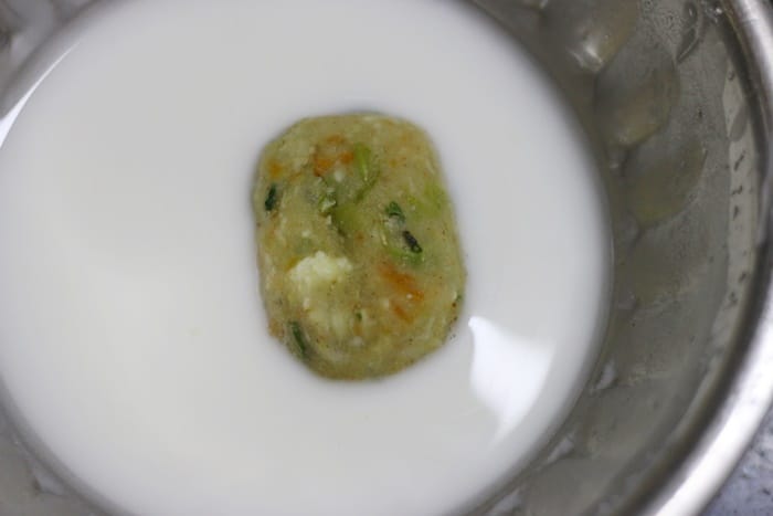 dipping shaped veg nugget in corn flour slurry