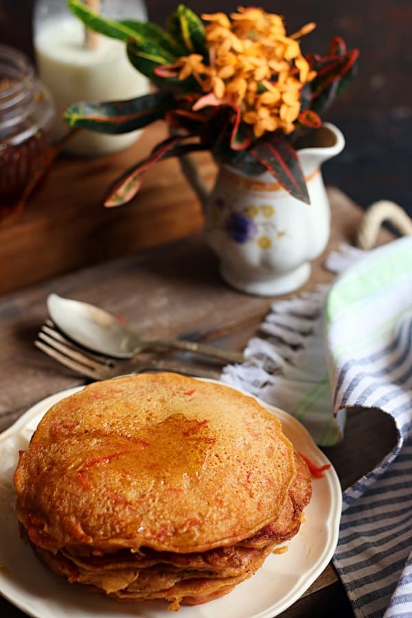 carrot pancakes served with honey