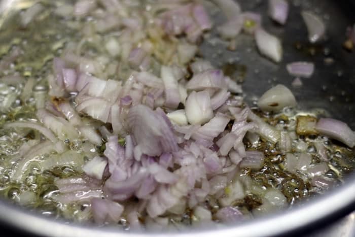 frying finely chopped onions in oil