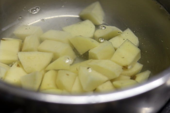 Par boiling cubed potatoes