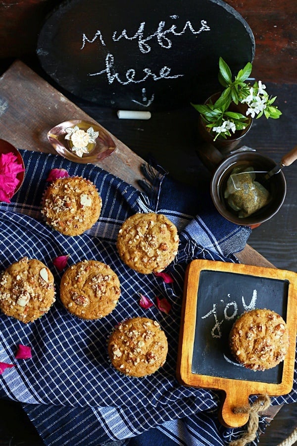 carrot muffins served for breakfast with a chalkboard handwritten menu