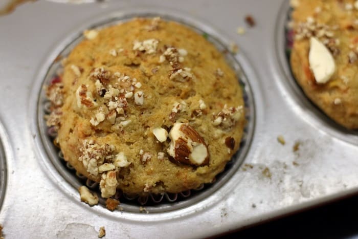 Freshly baked carrot muffins in a muffin tray