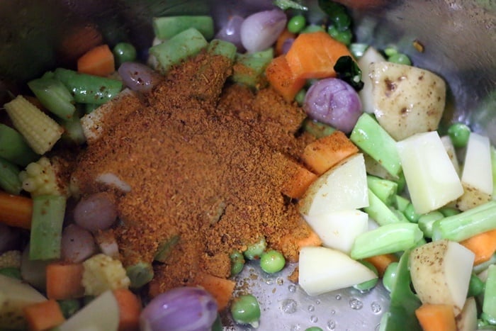 bisi bele bath powder added to sautéed vegetables.