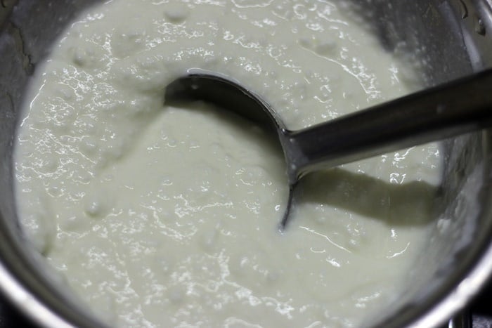Mixing rice, curd and milk for making thayir sadjam