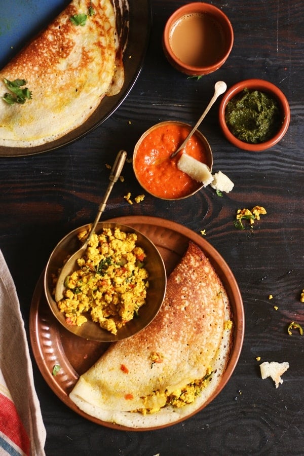 Paneer dosa served with coffee in a copper plate