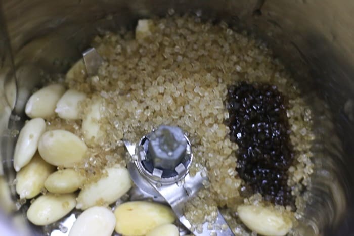 Blending almonds and sugar for making badam shake recipe
