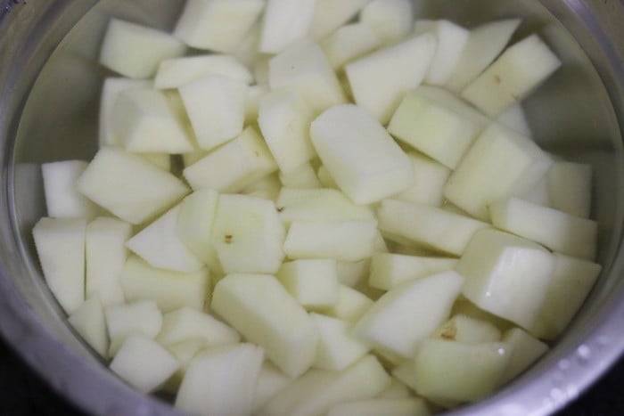 Cubed potatoes soaked in water for making potato roast